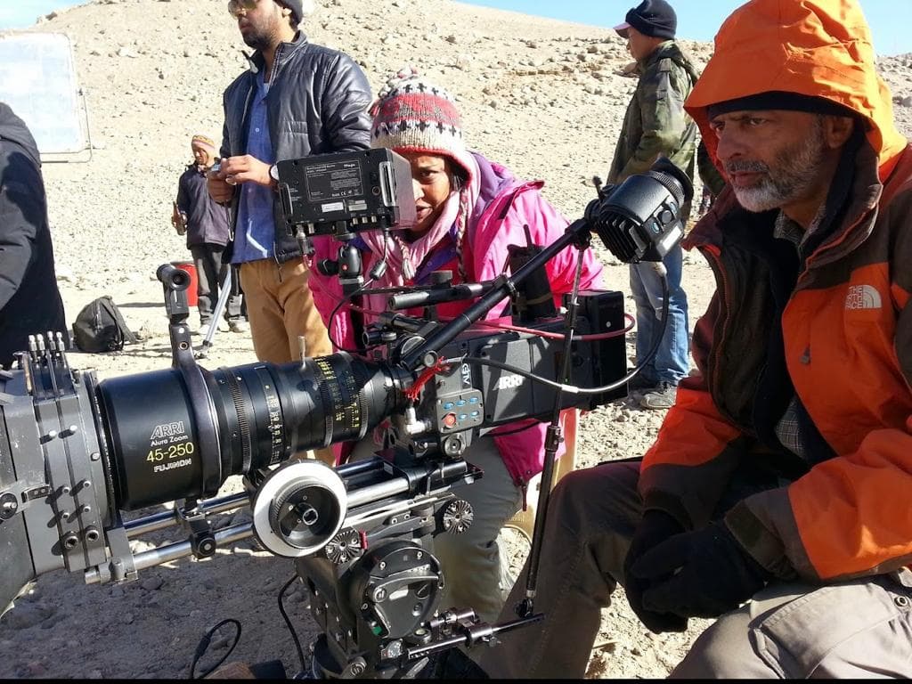 Cinematographer Arvind Kannabiran and camera operator aligning an ARRI digital cinema camera in the rugged desert terrain of Ladakh